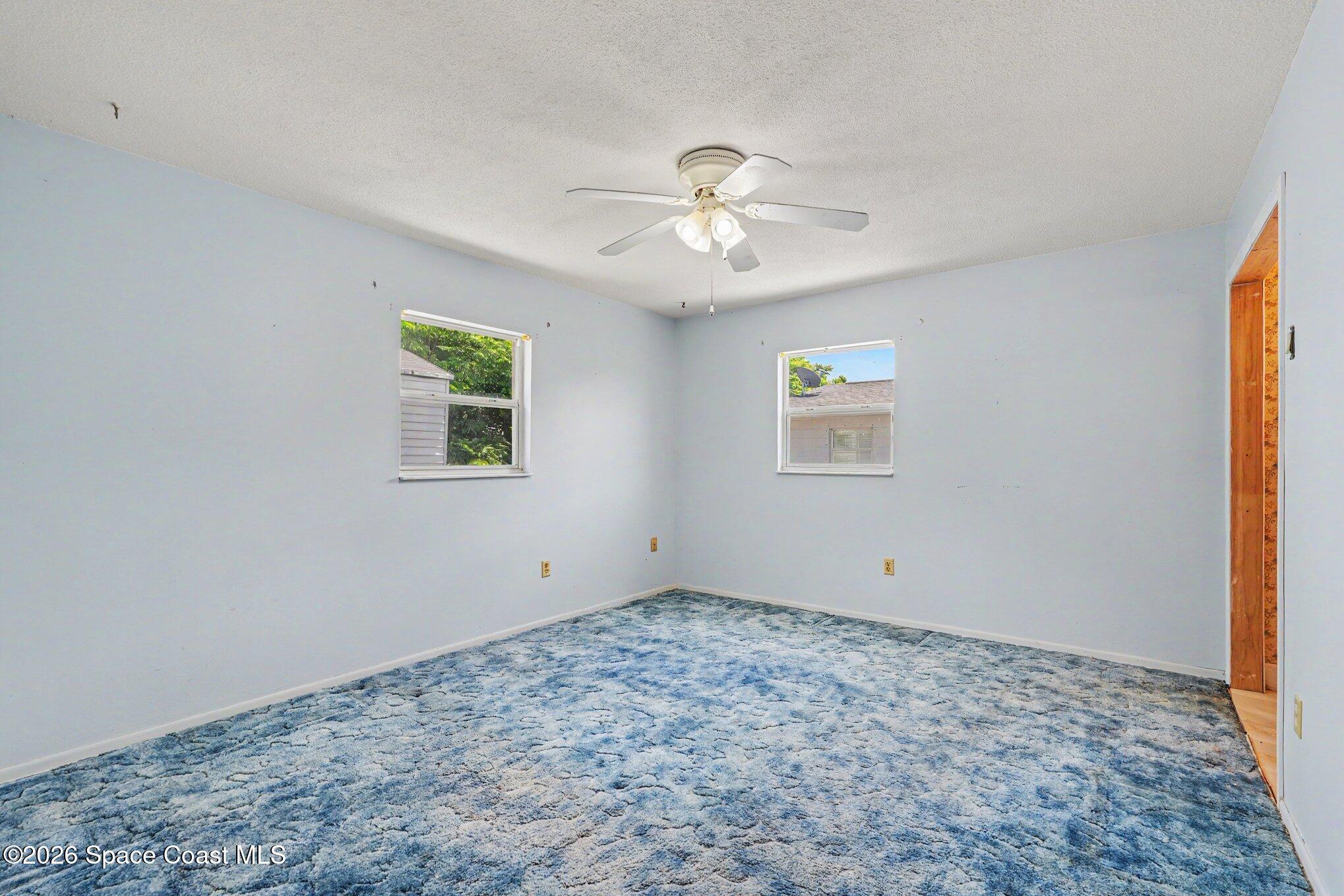 1671 Rice Avenue Titusville, FL 32796 - Photo 12 of 23 a view of an empty room with a window