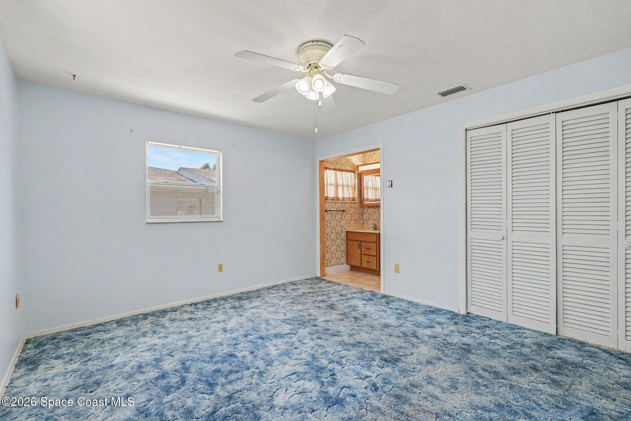 1671 Rice Avenue Titusville, FL 32796 - Photo 13 of 23 a view of an empty room with a window