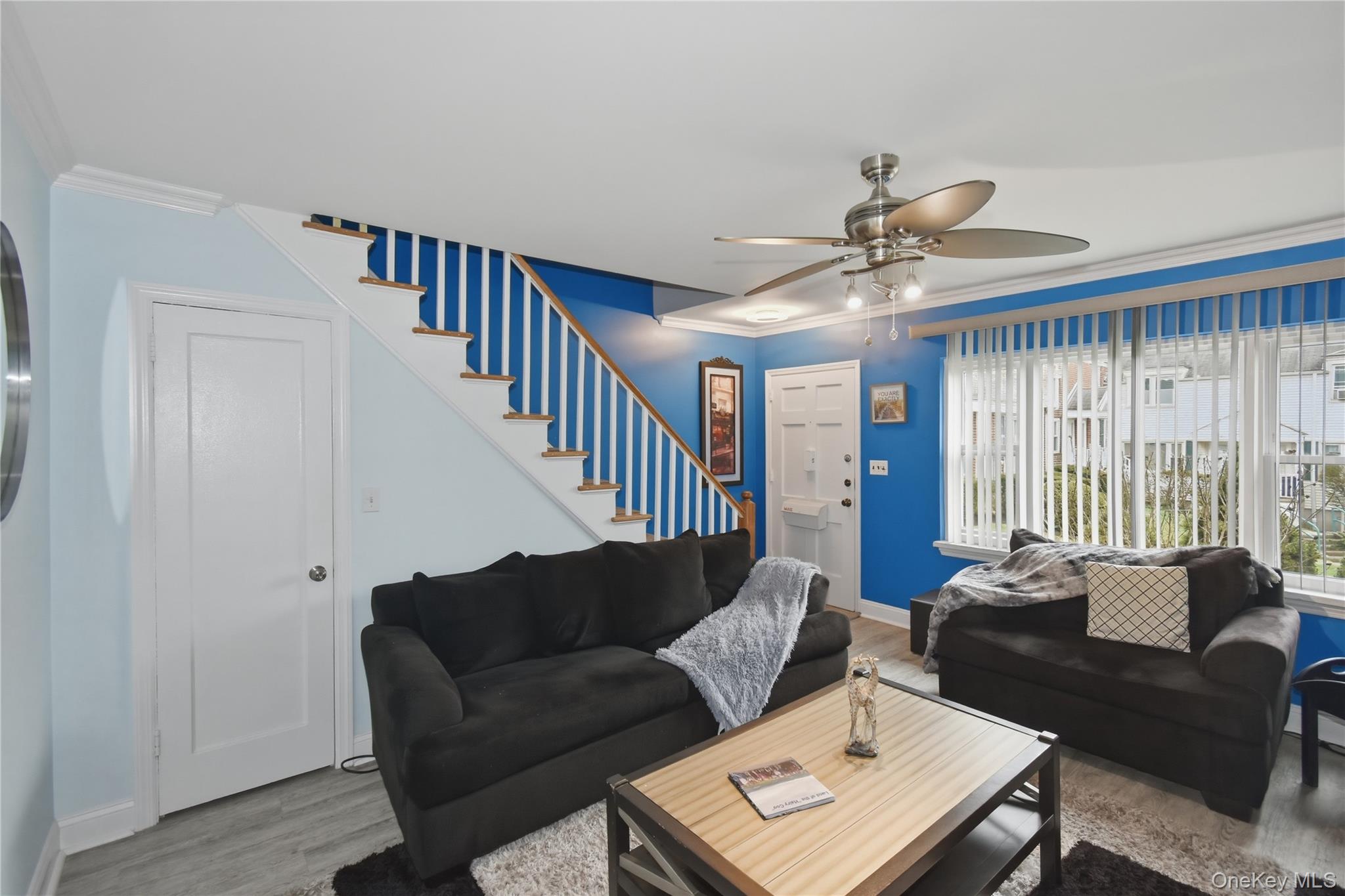 737 Tuckahoe Road, Unit 23 Yonkers, NY 10710 - Photo 3 of 13 a living room with furniture ceiling fan and a window