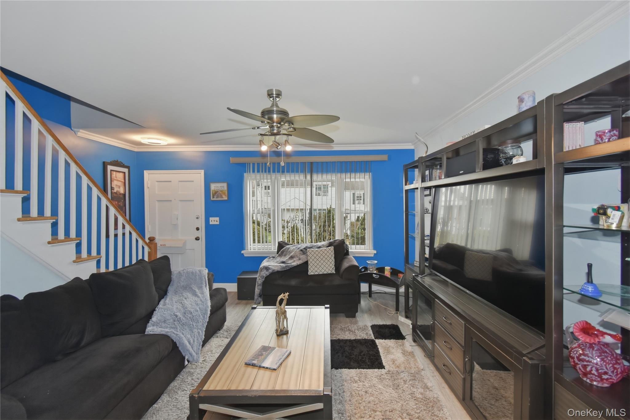 737 Tuckahoe Road, Unit 23 Yonkers, NY 10710 - Photo 4 of 13 a living room with furniture and a flat screen tv