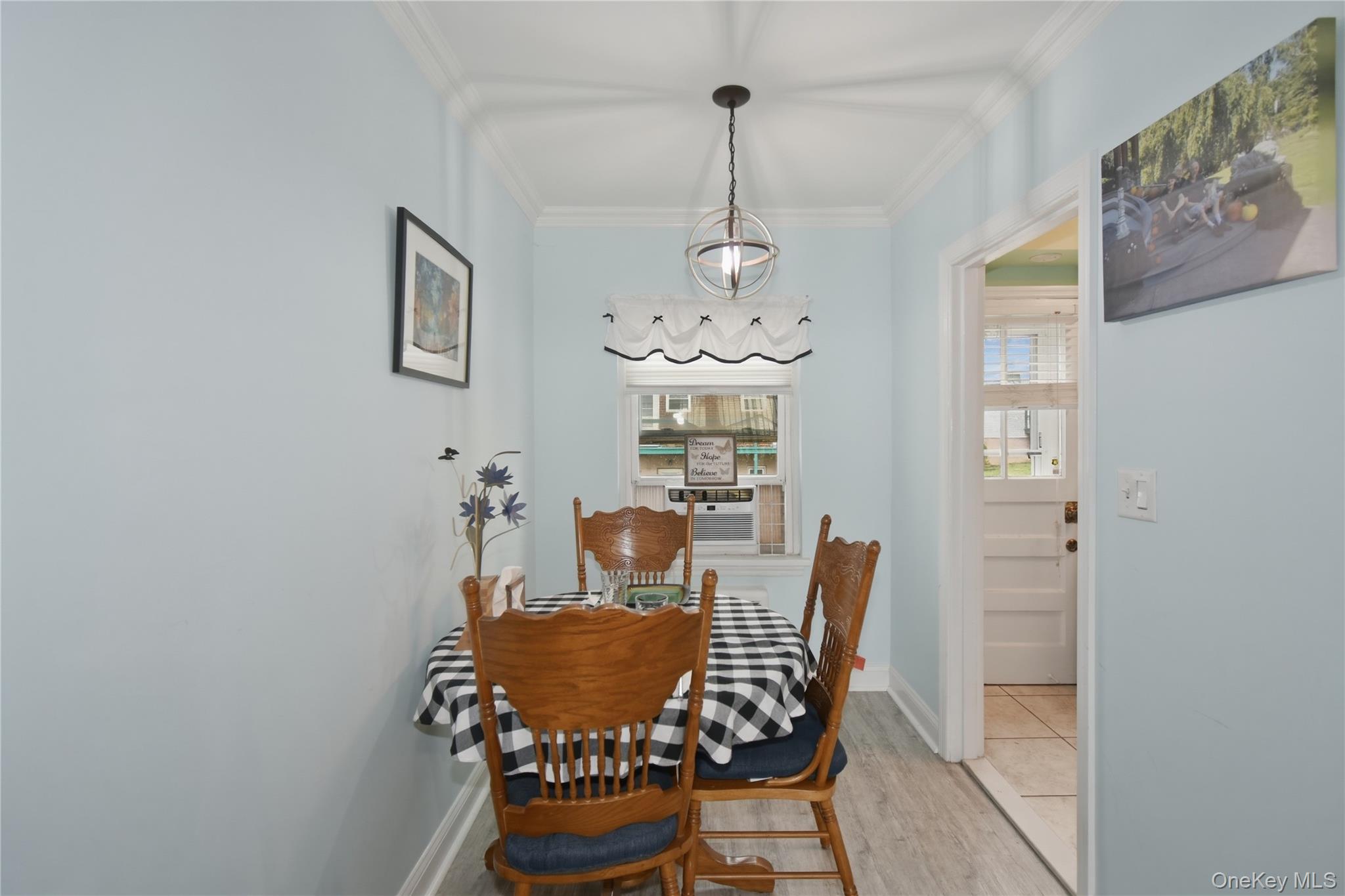 737 Tuckahoe Road, Unit 23 Yonkers, NY 10710 - Photo 8 of 13 a dining room with furniture and chandelier