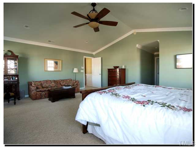 10702 Friendly Neighbor Lane Raleigh, NC 27614 - Photo 12 of 25 Master suite will easily accommodate a king bed and still have room for a sitting area, secretary, and more. Master Bedroom