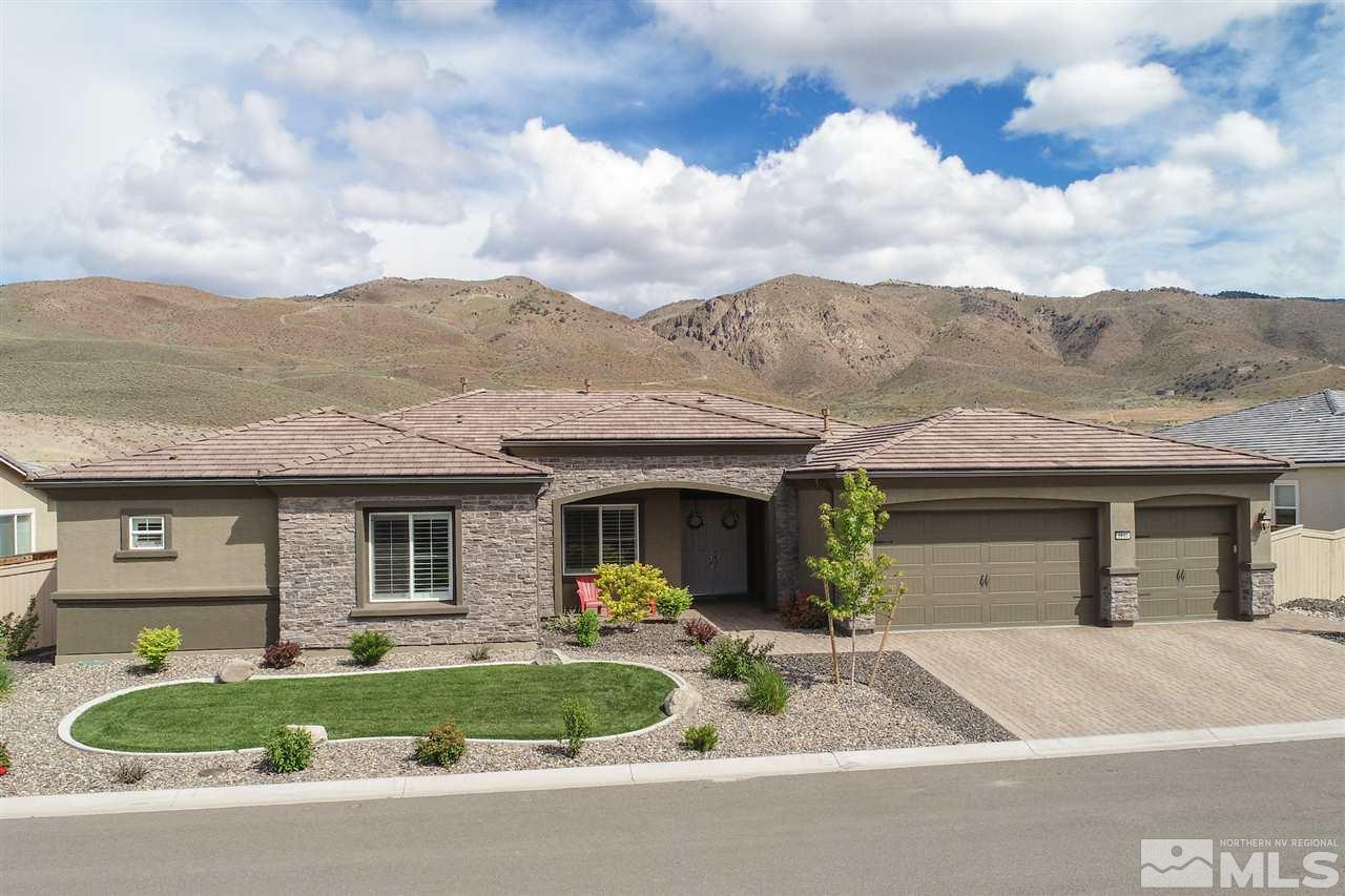 9840 Gainsborough Lane Reno, NV 89521 - Photo 1 of 24 a front view of a house with garden