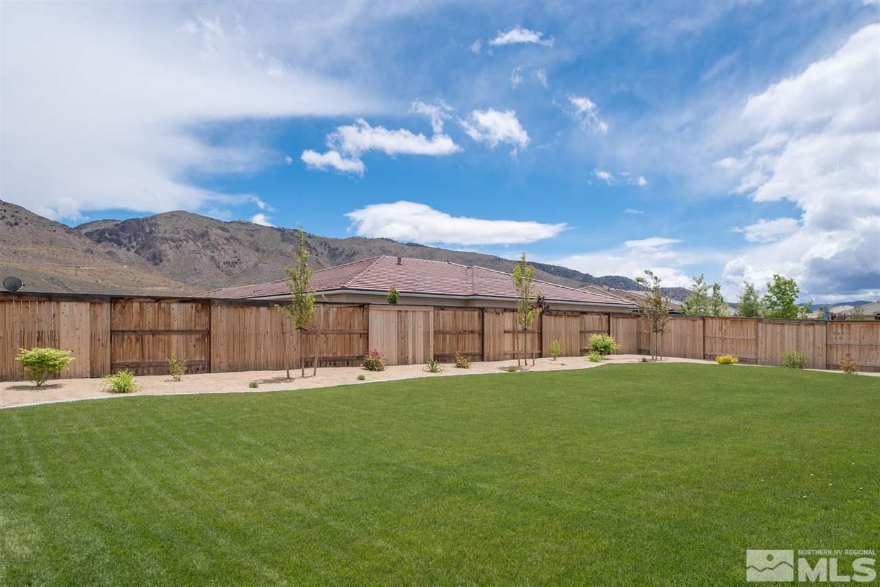 9840 Gainsborough Lane Reno, NV 89521 - Photo 20 of 24 a backyard of a house with table and chairs