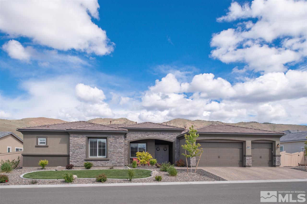 9840 Gainsborough Lane Reno, NV 89521 - Photo 2 of 24 a front view of a house with yard