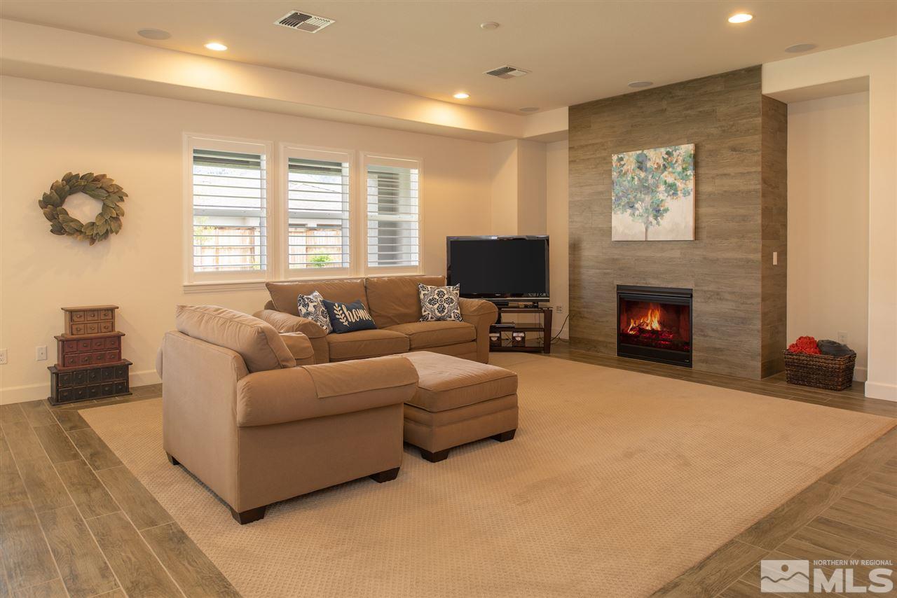 9840 Gainsborough Lane Reno, NV 89521 - Photo 3 of 24 a living room with furniture and a fireplace