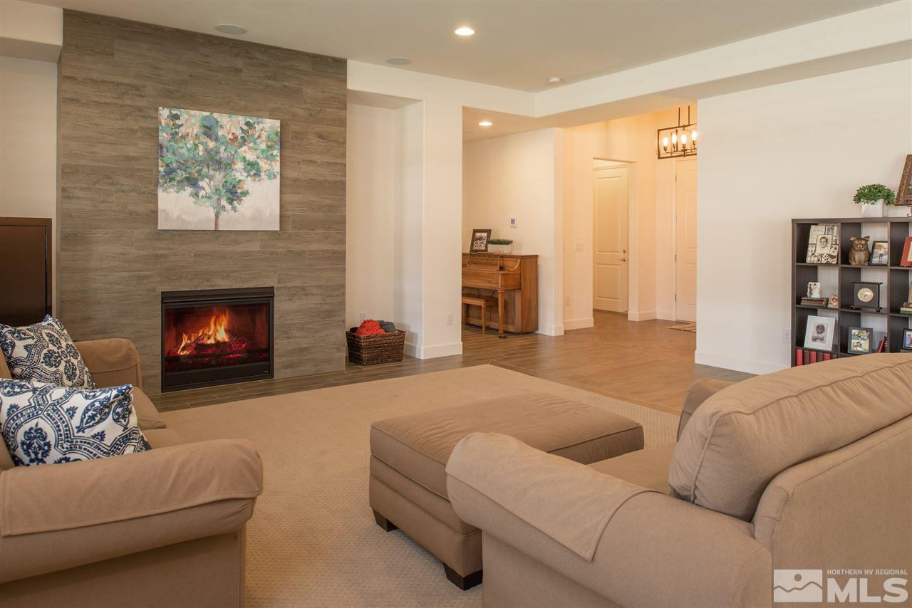 9840 Gainsborough Lane Reno, NV 89521 - Photo 5 of 24 a living room with furniture and a fireplace