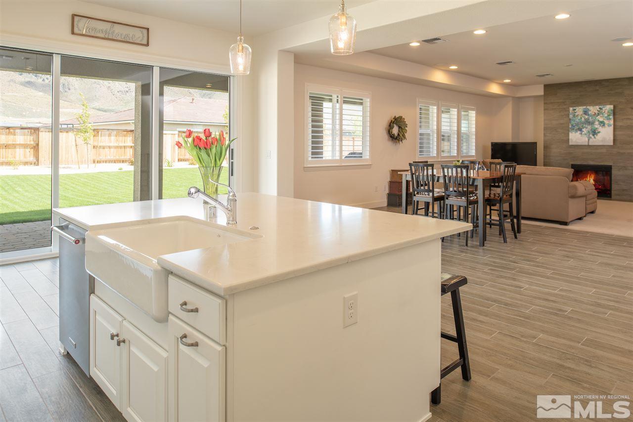 9840 Gainsborough Lane Reno, NV 89521 - Photo 8 of 24 a kitchen with center island table and chairs
