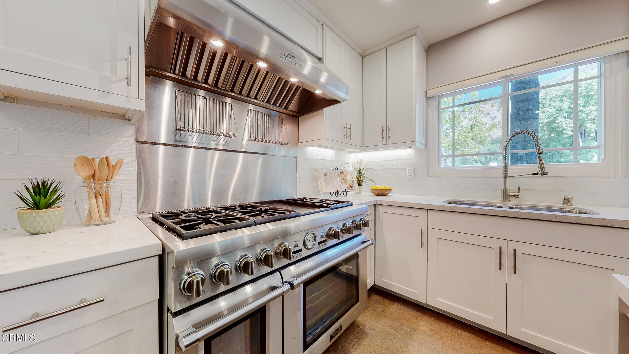 462 Devonwood Road Altadena, CA 91001 - Photo 14 of 39 a kitchen with granite countertop a sink stove and cabinets