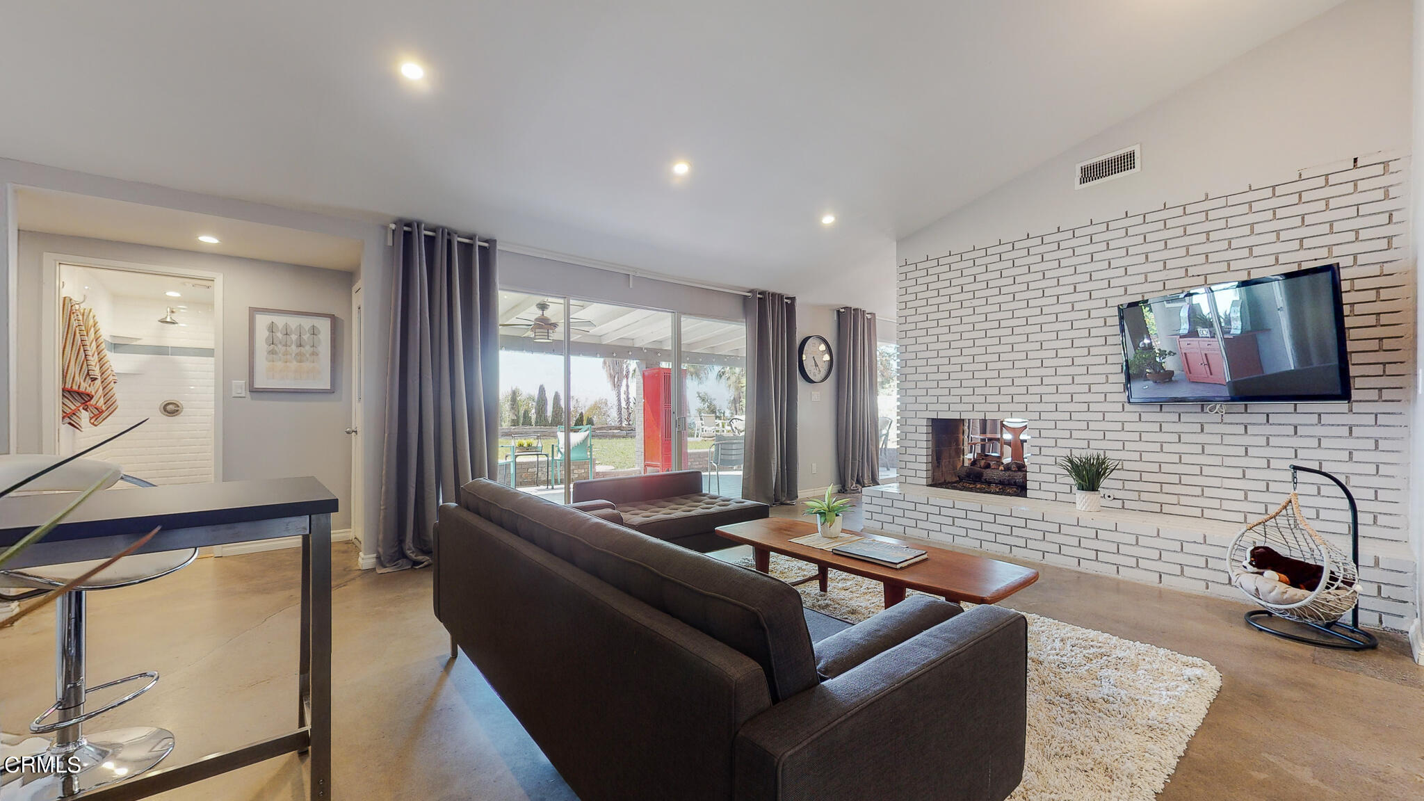 462 Devonwood Road Altadena, CA 91001 - Photo 7 of 39 a living room with fireplace furniture and a flat screen tv