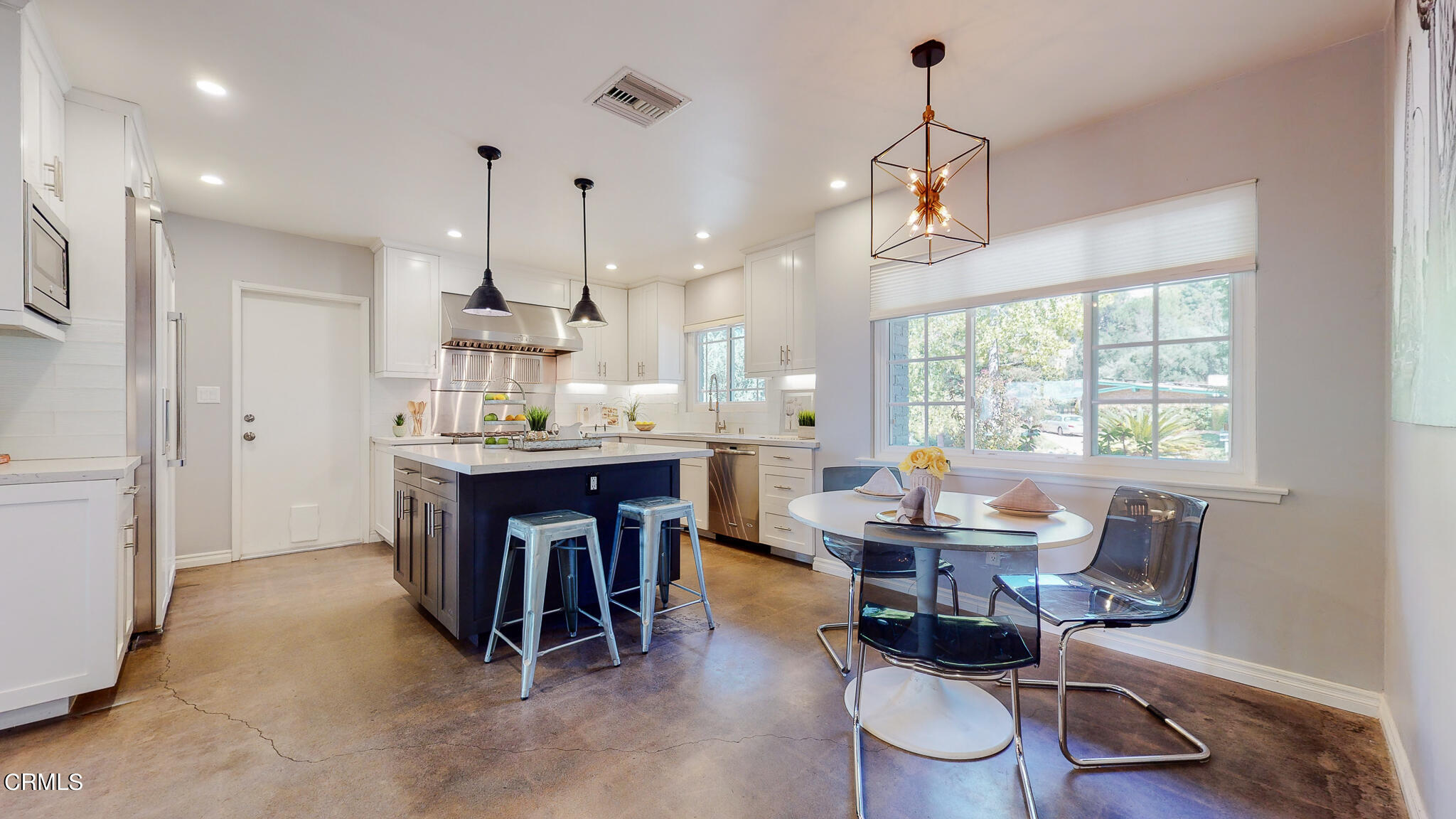 462 Devonwood Road Altadena, CA 91001 - Photo 8 of 39 a dining room with wooden floor a chandelier a wooden table and chairs