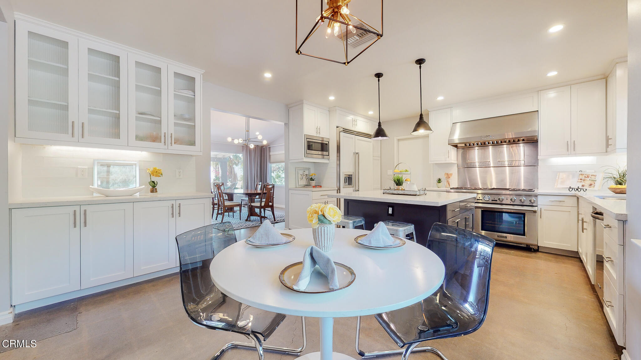 462 Devonwood Road Altadena, CA 91001 - Photo 10 of 39 a kitchen with stainless steel appliances kitchen island granite countertop a sink a stove a dining table and chairs