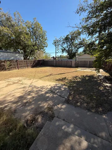 a view of a swimming pool with an outdoor space and seating area