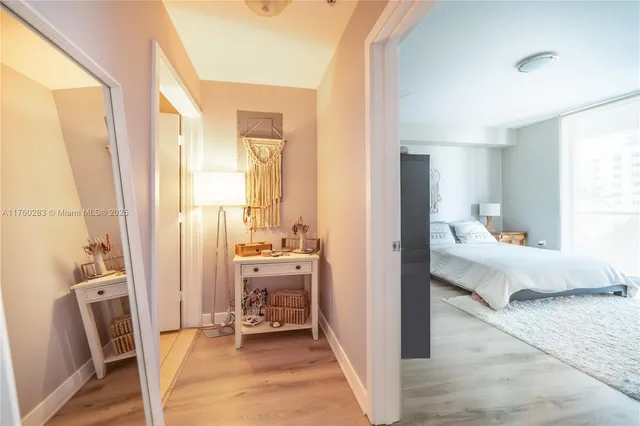 a bedroom with furniture and a window