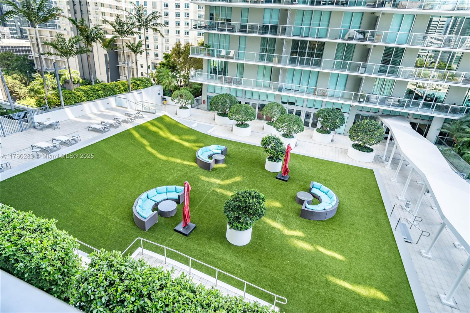 1111 Southwest 1st Avenue, Unit 1115N Miami, FL 33130 - Photo 25 of 27 a green field with some plants and trees in the background