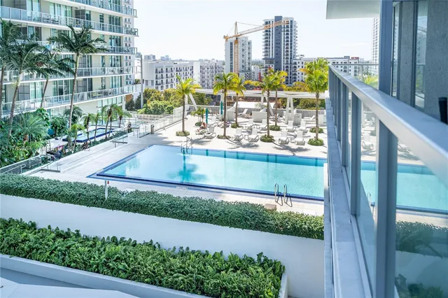 a view of a balcony with wooden floor