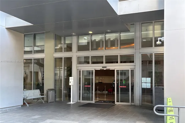 a view of a building with a glass door