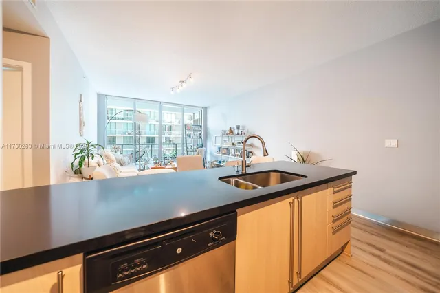 a kitchen with a sink and a window