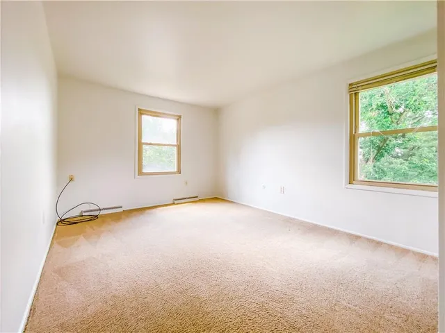 a view of empty room with windows