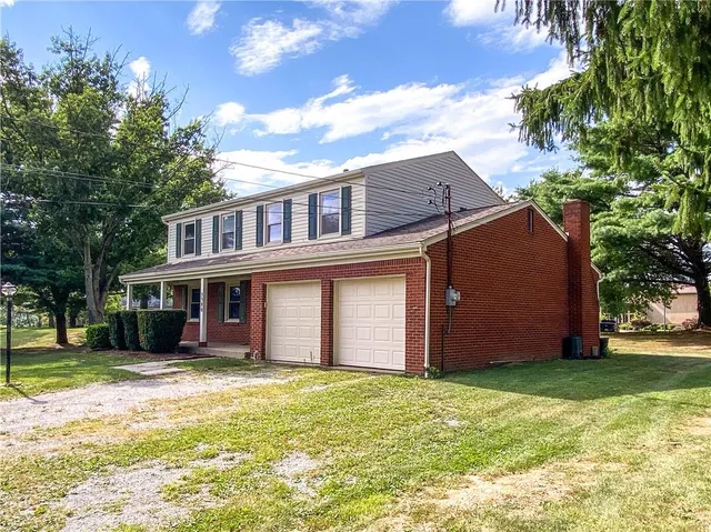 a view of a house with a garden