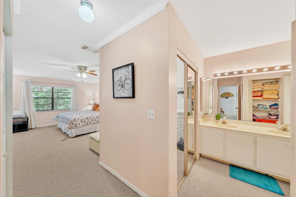 9278 Vista Del Lago, Unit 31F Boca Raton, FL 33428 - Photo 22 of 33 a living room with furniture and a large window