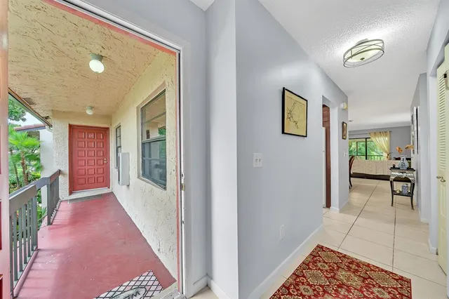 a kitchen with a refrigerator sink and cabinets