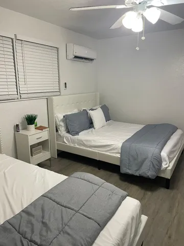 a bedroom with a bed and a dresser