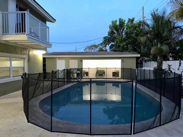 a living room with table and chairs