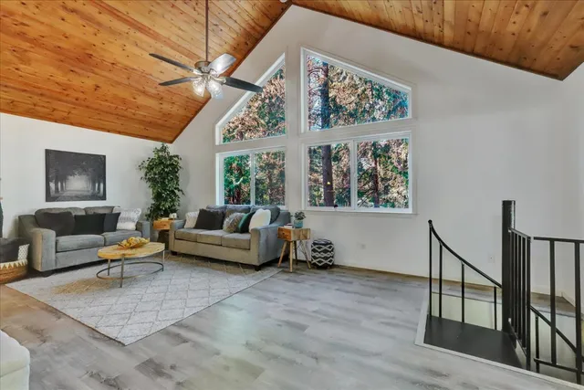 a bedroom with a bed and a wall painting