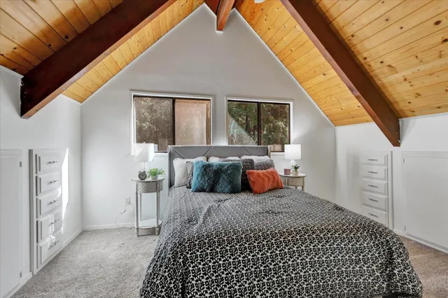 a view of empty room with wooden floor and window