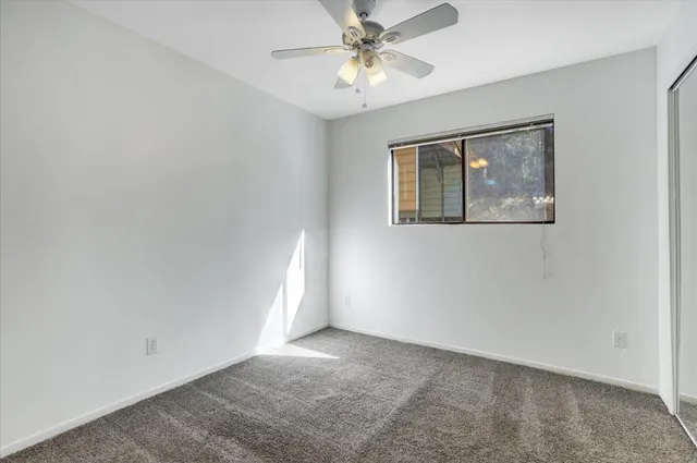 a view of balcony with wooden floor