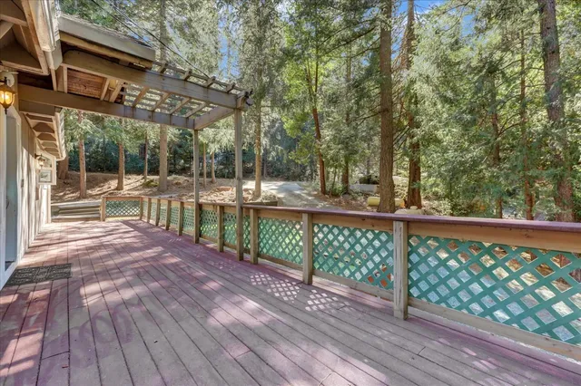 a view of backyard with roof deck and entertaining space