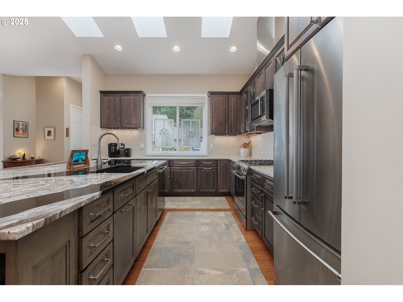 108 Sea Crest Court Otter Rock, OR 97369 - Photo 15 of 45 a kitchen with stainless steel appliances kitchen island granite countertop a sink stove and cabinets