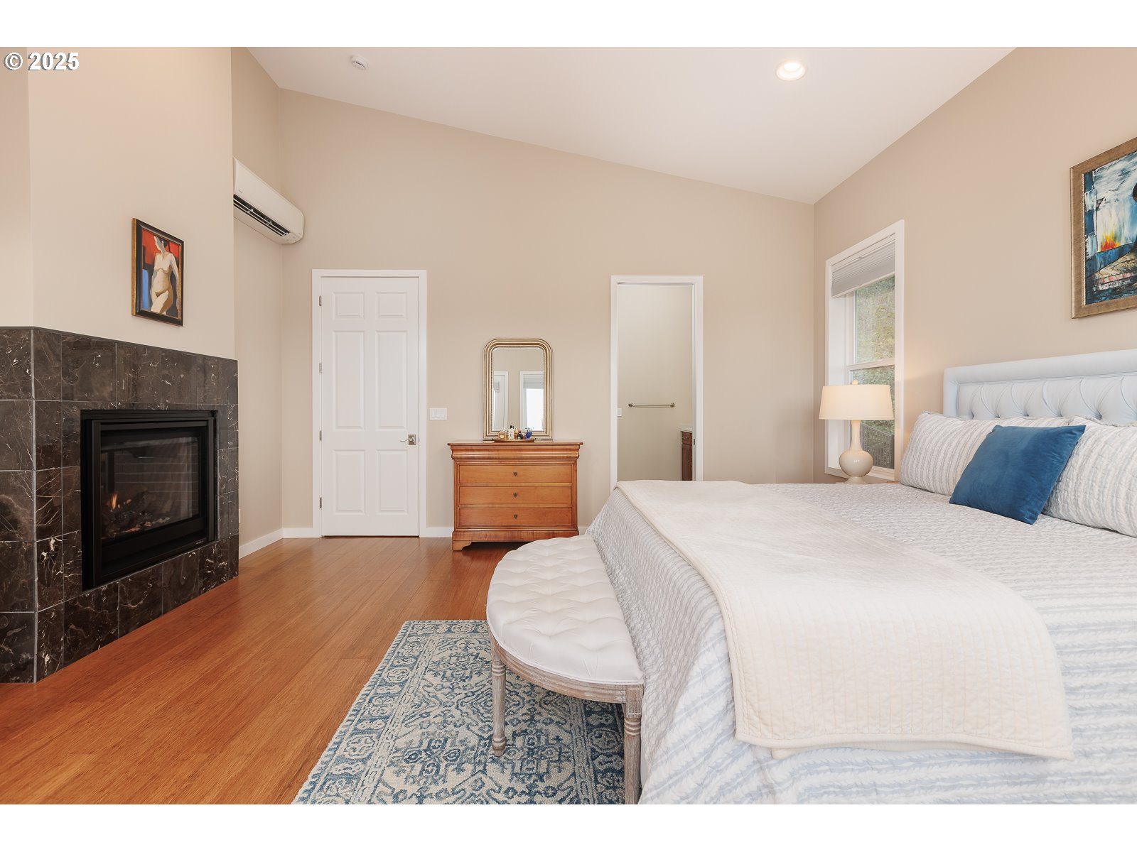 108 Sea Crest Court Otter Rock, OR 97369 - Photo 19 of 45 a spacious bedroom with a bed and a fireplace