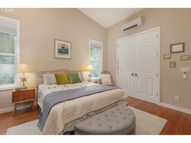 a bedroom with a bed and a lamp