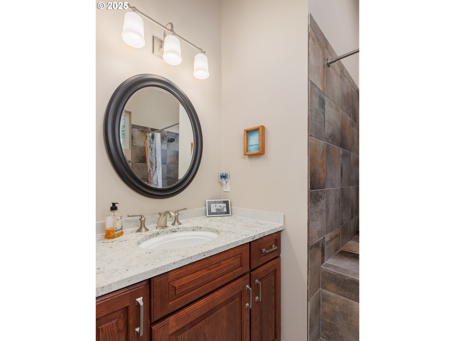 108 Sea Crest Court Otter Rock, OR 97369 - Photo 30 of 45 a bathroom with a granite countertop sink and a mirror
