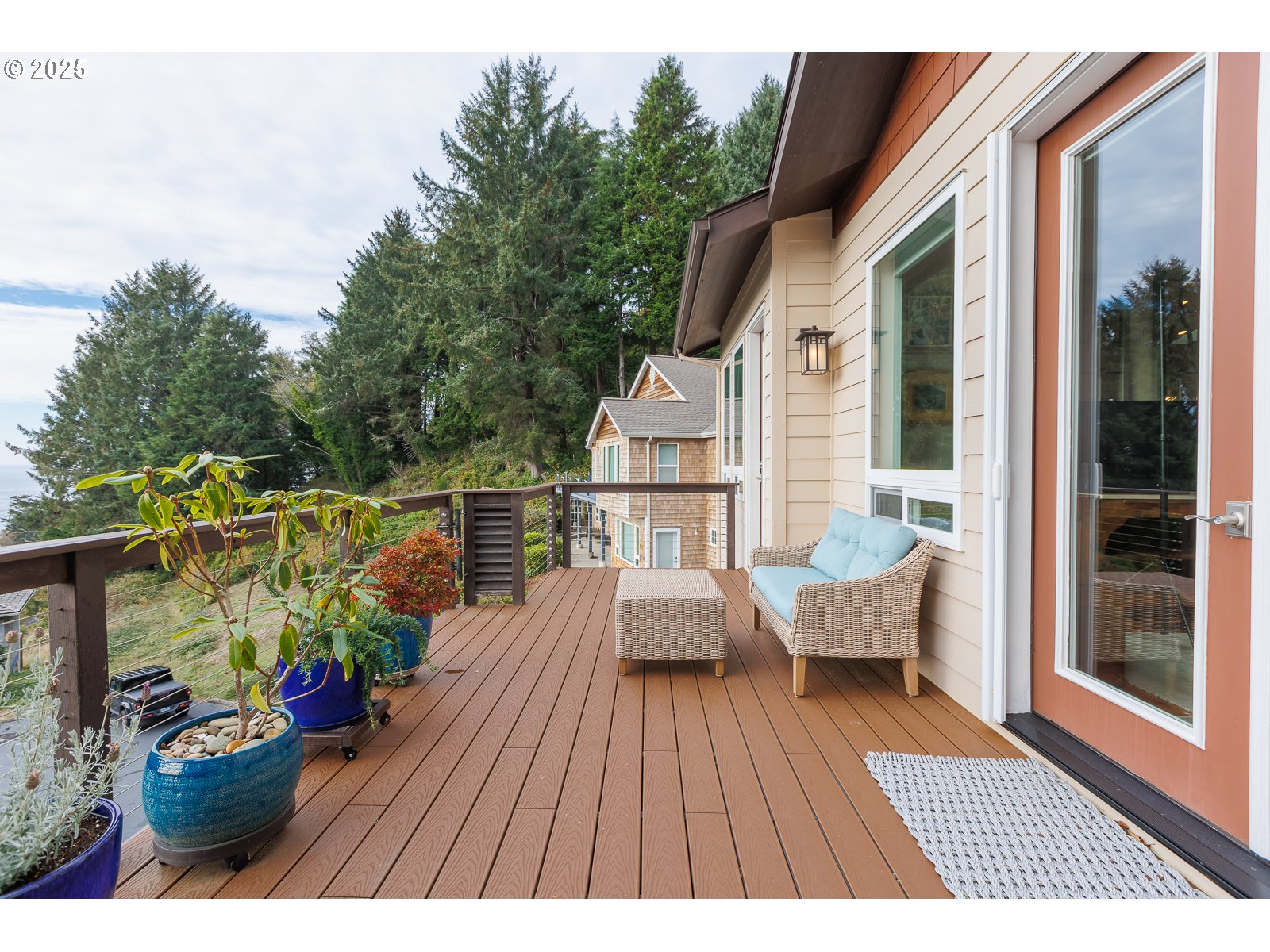 108 Sea Crest Court Otter Rock, OR 97369 - Photo 33 of 45 a balcony with wooden floor table and chairs