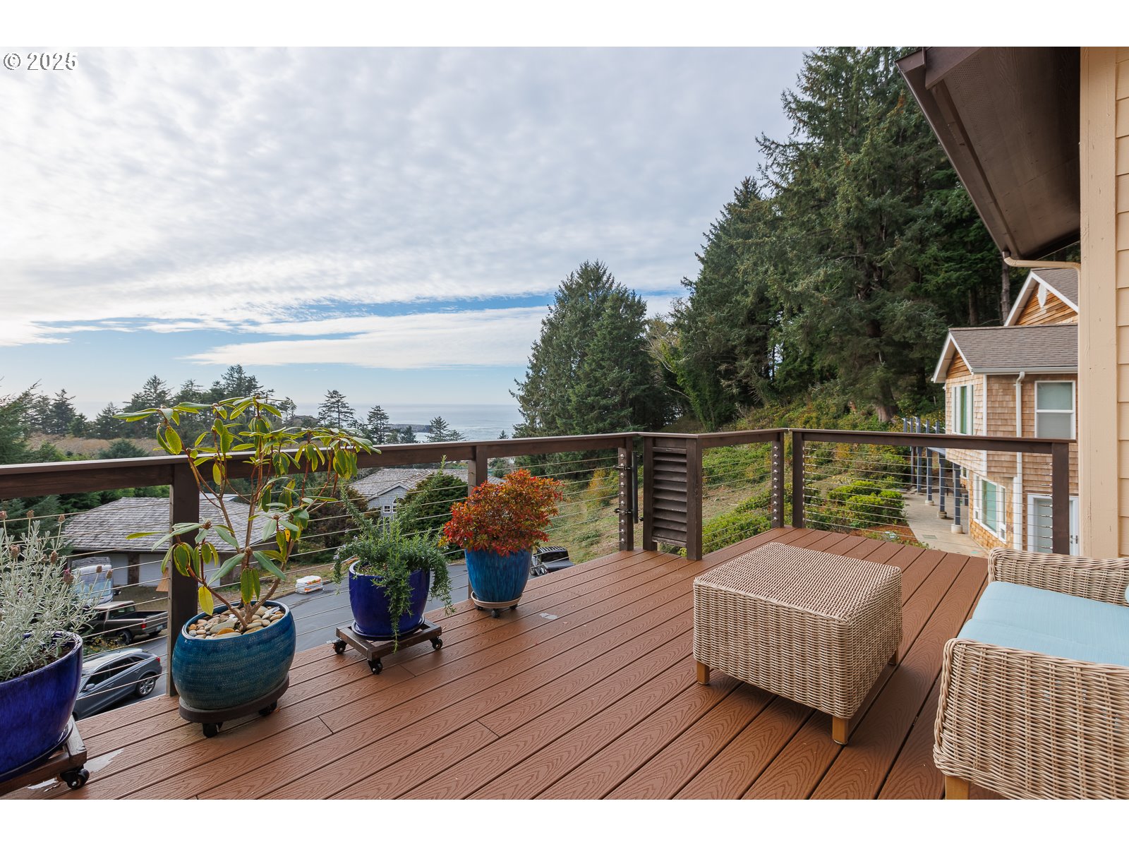 108 Sea Crest Court Otter Rock, OR 97369 - Photo 34 of 45 a view of a roof deck with table and chairs potted plants with wooden floor