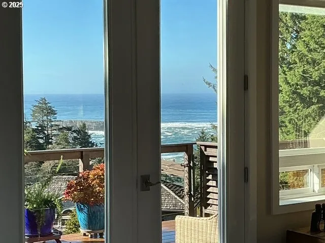 a view of a glass door and a yard