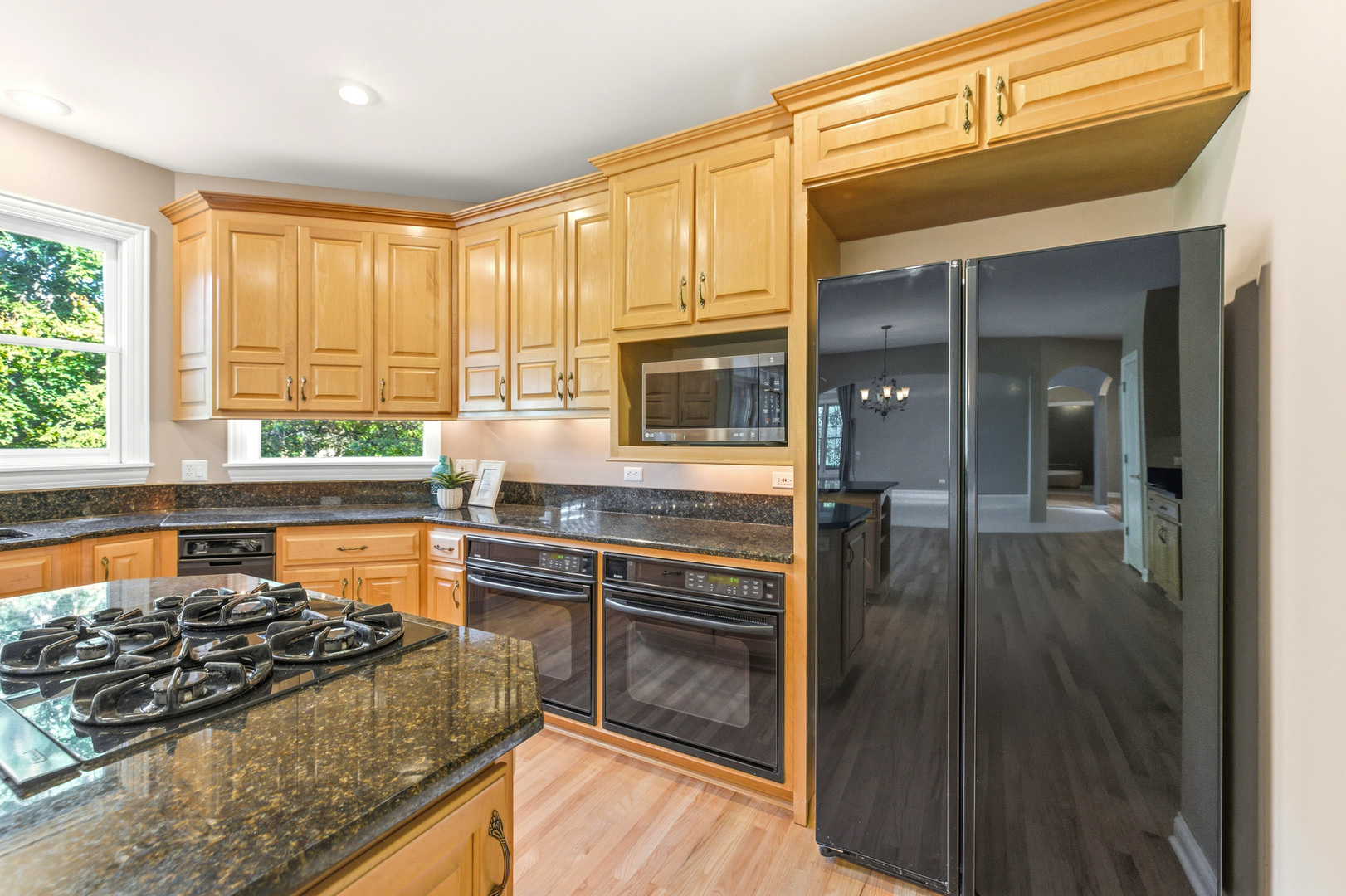 37-w004 Ridgewood Drive St. Charles, IL 60175 - Photo 17 of 44 a kitchen with stainless steel appliances granite countertop a stove and a refrigerator