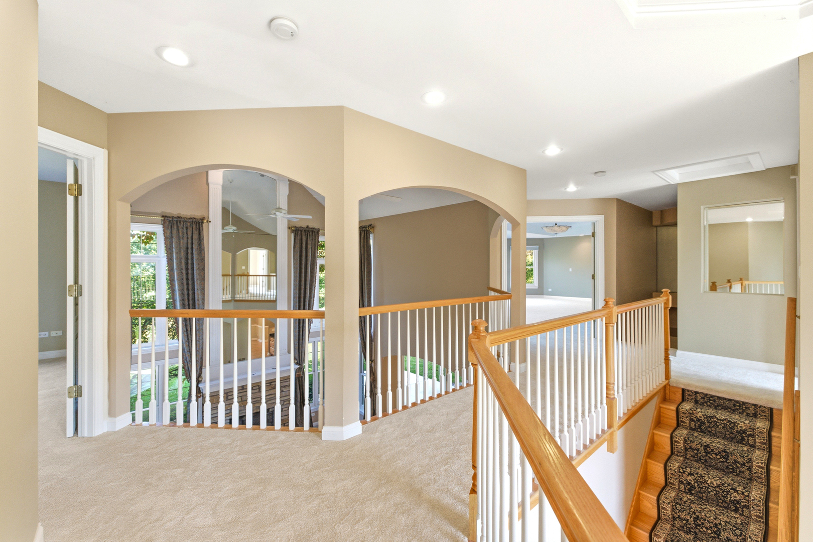 37-w004 Ridgewood Drive St. Charles, IL 60175 - Photo 19 of 44 a view of a hallway with a livingroom with sliding door and stairs