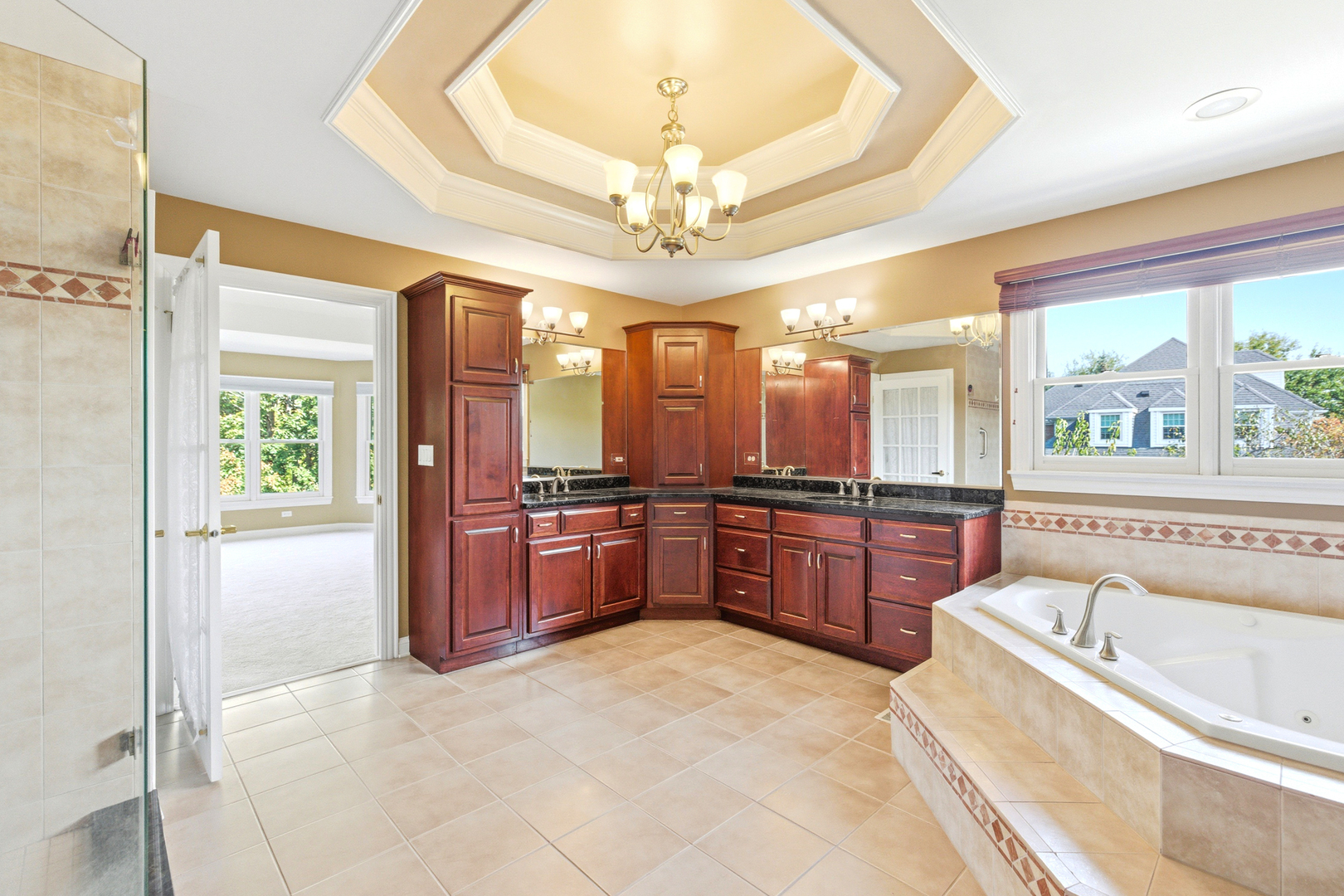 37-w004 Ridgewood Drive St. Charles, IL 60175 - Photo 25 of 44 a large spacious bathroom with a tub a sink and a large mirror