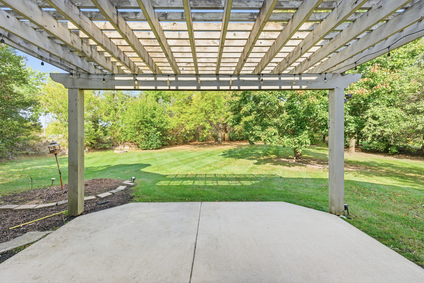 37-w004 Ridgewood Drive St. Charles, IL 60175 - Photo 35 of 44 a view of a yard with porch and outdoor space