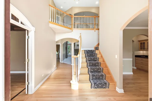 a view of a dining room with furniture wooden floor and chandelier