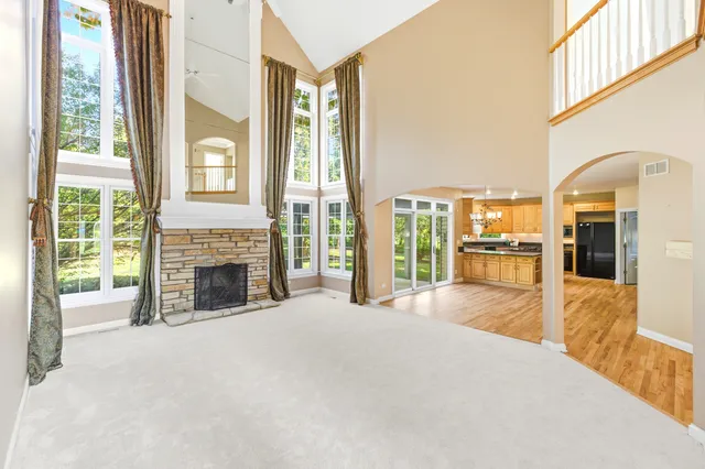 a kitchen with stainless steel appliances granite countertop a stove and a refrigerator