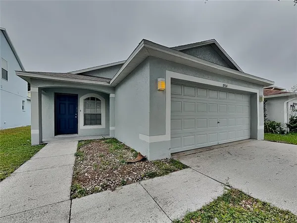 a front view of a house with a garage