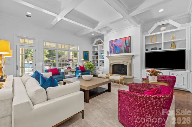 a living room with furniture fireplace and flat screen tv