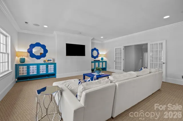 a bedroom with a bed couch and window