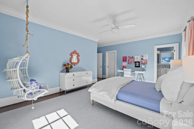 a bathroom with a granite countertop toilet sink and mirror