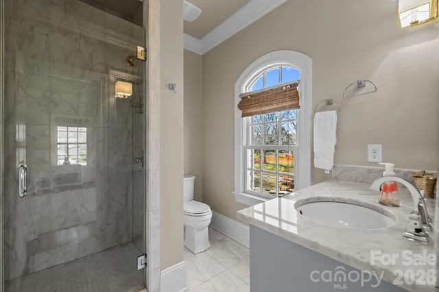 a balcony with furniture and a grill